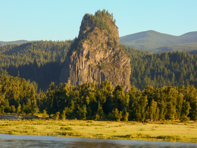 tall, cylindrical rock jutting up above the river