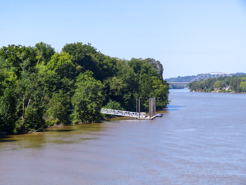 Blue sky and blue Ohio River with treed islands and hills