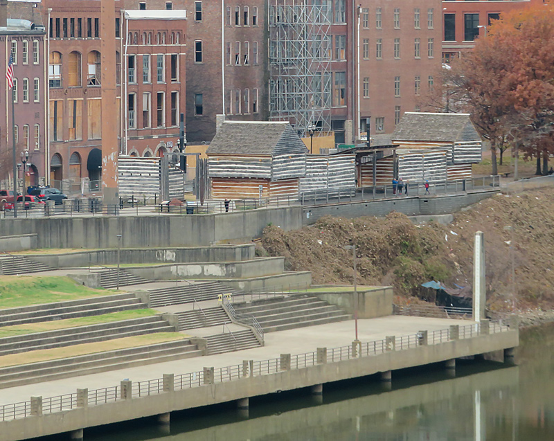 the wooden frontier Fort Nashborough is surround by tall Nashville buildings